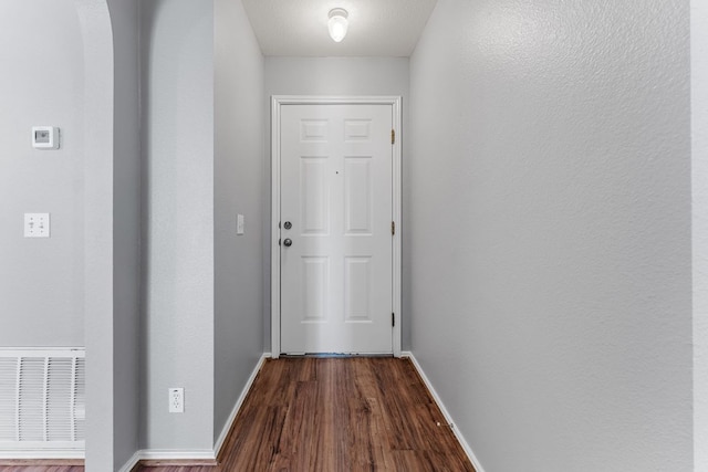 184 Atlantis, Kyle, TX 78640 - doorway to outside featuring dark wood-style flooring and baseboards