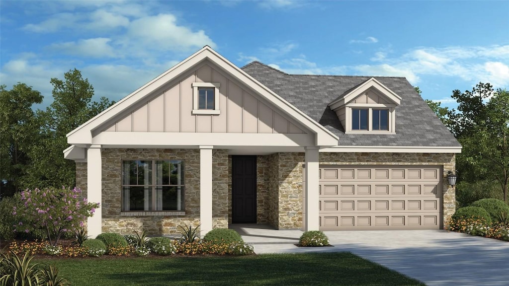 4334 Bancroft Ln, Round Rock, TX 78665 - view of front of house with stone siding, board and batten siding, driveway, and an attached garage
