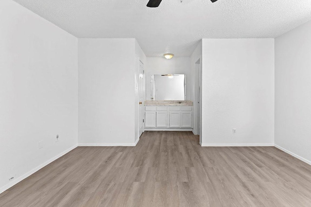 500 Honeysuckle Dr, Cedar Park, TX 78613 - unfurnished room with ceiling fan, light wood-type flooring, and a textured ceiling