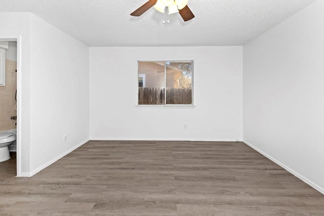 500 Honeysuckle Dr, Cedar Park, TX 78613 - unfurnished room featuring ceiling fan, wood finished floors, and a textured ceiling