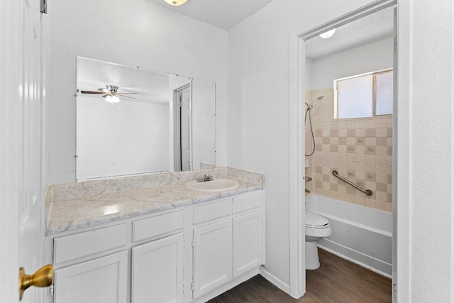500 Honeysuckle Dr, Cedar Park, TX 78613 - full bath featuring vanity, wood finished floors, shower / washtub combination, a textured ceiling, and a ceiling fan