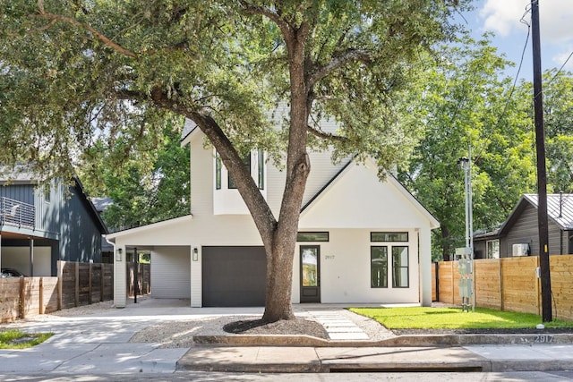 2917 Lyons Rd Unit 1, Austin, TX 78702 - view of front facade featuring driveway and a garage