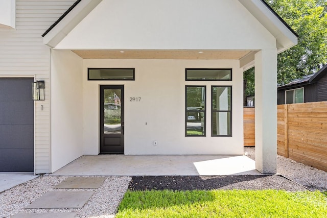 2917 Lyons Rd Unit 1, Austin, TX 78702 - entrance to property featuring a garage and stucco siding