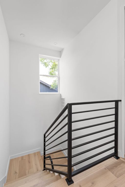 2917 Lyons Rd Unit 1, Austin, TX 78702 - stairs with wood finished floors and baseboards