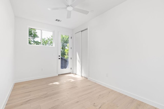 2917 Lyons Rd Unit 1, Austin, TX 78702 - empty room with ceiling fan and light wood-style floors