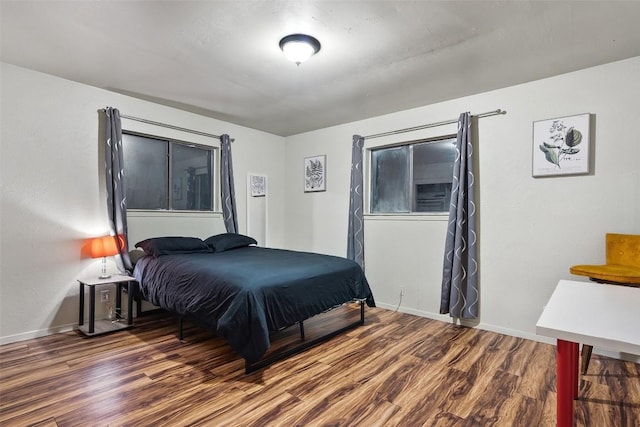 2503 Parker Ln Unit A & B, Austin, TX 78741 - bedroom featuring wood finished floors and baseboards