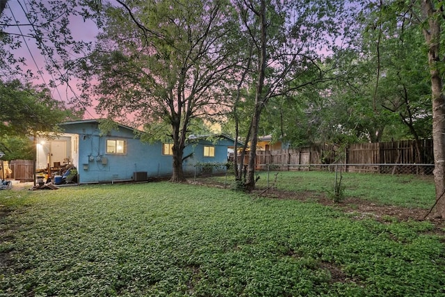 2503 Parker Ln Unit A & B, Austin, TX 78741 - yard at dusk featuring a fenced backyard