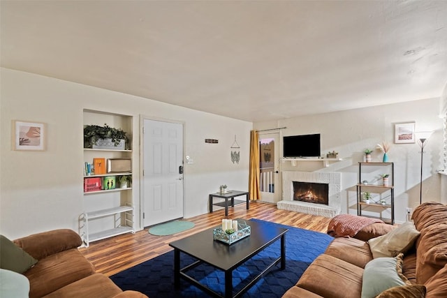 2503 Parker Ln Unit A & B, Austin, TX 78741 - living room with wood finished floors and a fireplace