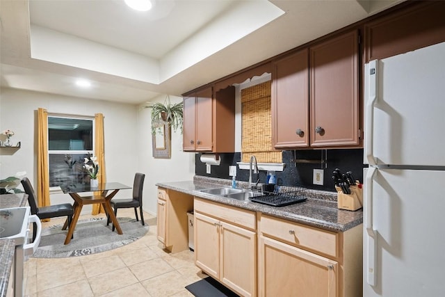 2503 Parker Ln Unit A & B, Austin, TX 78741 - kitchen with white appliances, light tile patterned floors, tasteful backsplash, dark countertops, and recessed lighting