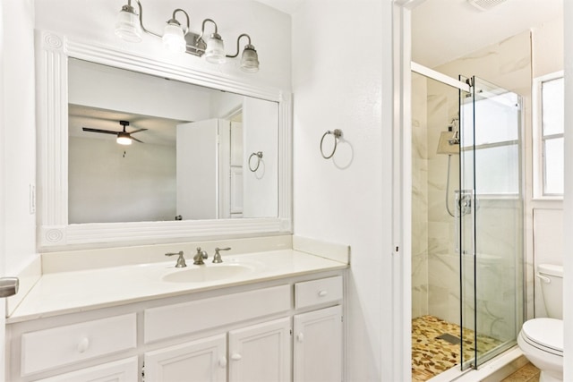 8511 Slant Oak Dr, Austin, TX 78729 - full bathroom featuring a stall shower, vanity, and ceiling fan