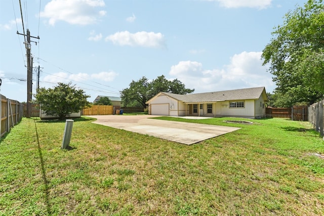 8511 Slant Oak Dr, Austin, TX 78729 - rear view of property with a fenced backyard, driveway, and a patio area