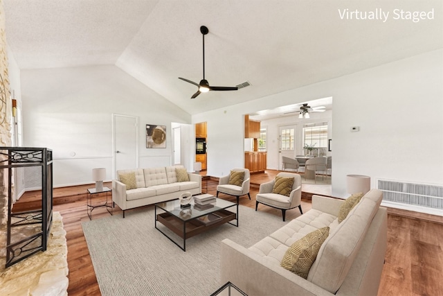 8511 Slant Oak Dr, Austin, TX 78729 - living area featuring ceiling fan, wood finished floors, and vaulted ceiling