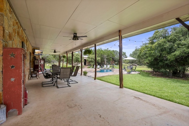 201 N Oak Vista Dr, Burnet, TX 78611 - view of patio featuring a ceiling fan, outdoor dining space, and an outdoor pool