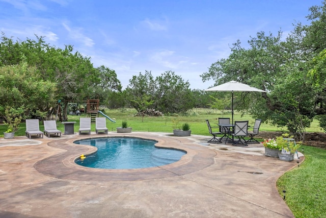 201 N Oak Vista Dr, Burnet, TX 78611 - outdoor pool with a patio area, a yard, and a playground