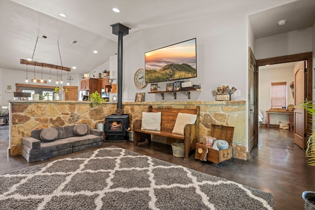 201 N Oak Vista Dr, Burnet, TX 78611 - living area with a wood stove, finished concrete floors, lofted ceiling, and recessed lighting