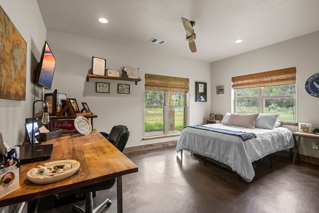 201 N Oak Vista Dr, Burnet, TX 78611 - bedroom with concrete floors, multiple windows, recessed lighting, a ceiling fan, and a desk