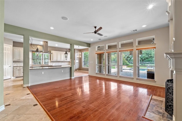 15208 Sunningdale St, Austin, TX 78717 - unfurnished living room featuring ceiling fan, recessed lighting, and light wood-type flooring
