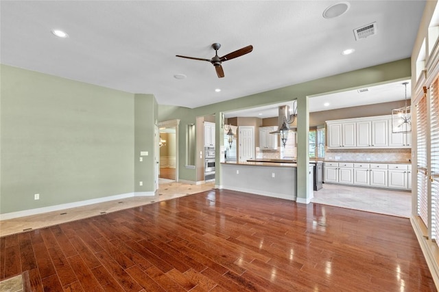 15208 Sunningdale St, Austin, TX 78717 - unfurnished living room featuring ceiling fan, light wood-type flooring, and recessed lighting