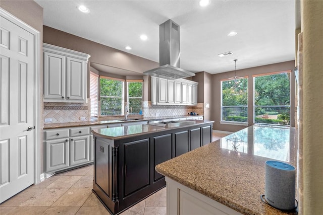 15208 Sunningdale St, Austin, TX 78717 - kitchen with tasteful backsplash, plenty of natural light, a kitchen island, and recessed lighting