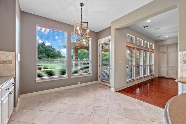 15208 Sunningdale St, Austin, TX 78717 - unfurnished dining area featuring plenty of natural light, a chandelier, light tile patterned floors, and recessed lighting