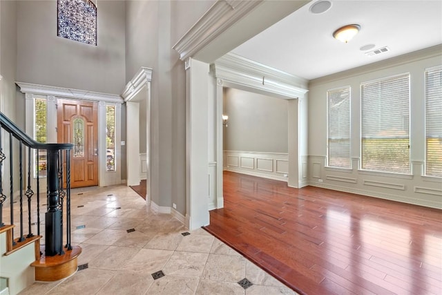 15208 Sunningdale St, Austin, TX 78717 - foyer with stairs, a decorative wall, crown molding, wainscoting, and a high ceiling