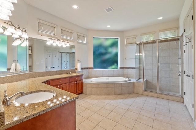 15208 Sunningdale St, Austin, TX 78717 - bathroom with vanity, a bath, healthy amount of natural light, a stall shower, and recessed lighting