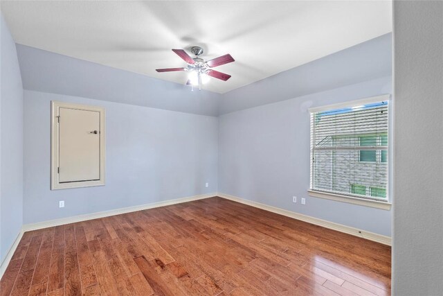 15208 Sunningdale St, Austin, TX 78717 - spare room featuring wood finished floors, a ceiling fan, and lofted ceiling
