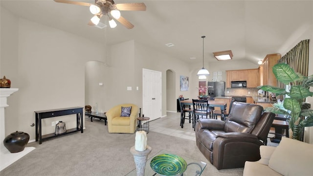 11017 Casitas Dr, Austin, TX 78717 - living room with arched walkways, ceiling fan, light carpet, and vaulted ceiling