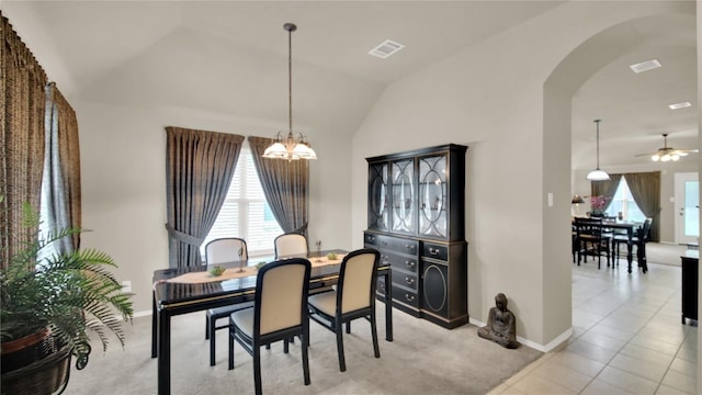 11017 Casitas Dr, Austin, TX 78717 - dining space featuring arched walkways, a chandelier, lofted ceiling, a ceiling fan, and light colored carpet