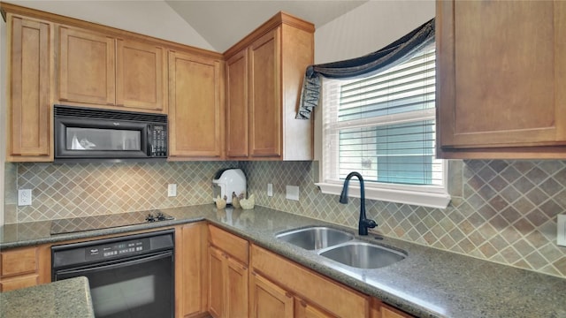 11017 Casitas Dr, Austin, TX 78717 - kitchen with black appliances, vaulted ceiling, decorative backsplash, brown cabinetry, and dark stone counters