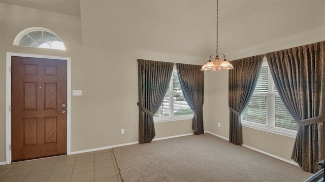 11017 Casitas Dr, Austin, TX 78717 - tiled entryway with a chandelier and a towering ceiling