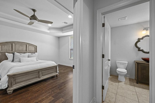 100 Eagle Landing Dr, Belton, TX 76513 - bedroom featuring a tray ceiling, ornamental molding, recessed lighting, light wood-style floors, and a ceiling fan