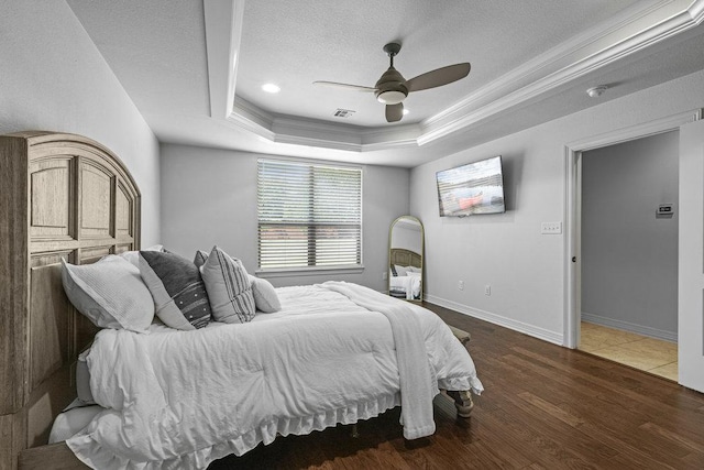 100 Eagle Landing Dr, Belton, TX 76513 - bedroom featuring a tray ceiling, crown molding, wood finished floors, a textured ceiling, and ceiling fan