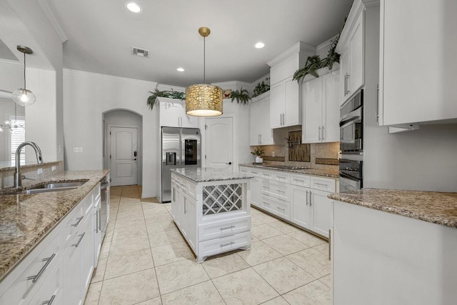 100 Eagle Landing Dr, Belton, TX 76513 - kitchen with decorative backsplash, arched walkways, stainless steel fridge, crown molding, and white cabinetry