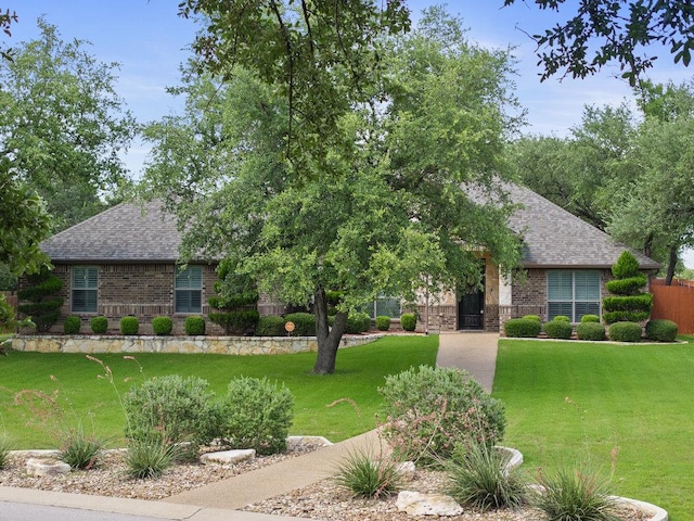 100 Eagle Landing Dr, Belton, TX 76513 - view of front of home with brick siding, a shingled roof, and a front yard