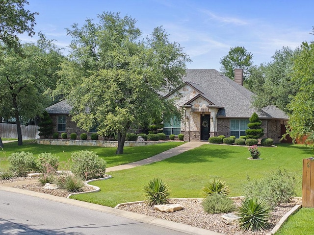 100 Eagle Landing Dr, Belton, TX 76513 - view of front of property featuring a chimney, brick siding, stone siding, and a shingled roof
