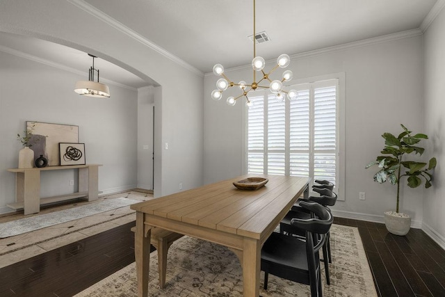 100 Eagle Landing Dr, Belton, TX 76513 - dining space with arched walkways, wood finished floors, crown molding, and a chandelier