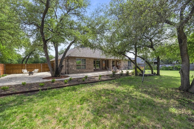 100 Eagle Landing Dr, Belton, TX 76513 - back of property with a patio, brick siding, and roof with shingles