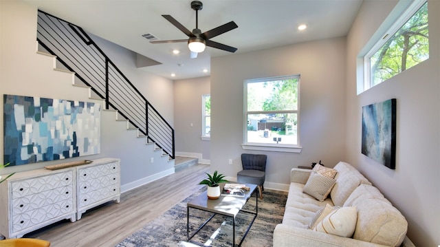 6111 Carnation Ter Unit 1, Austin, TX 78741 - living area with plenty of natural light, stairs, light wood-type flooring, a ceiling fan, and recessed lighting
