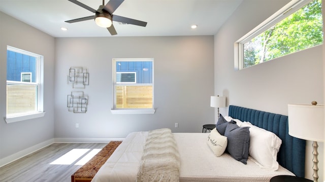 6111 Carnation Ter Unit 1, Austin, TX 78741 - bedroom with wood finished floors, a ceiling fan, and recessed lighting