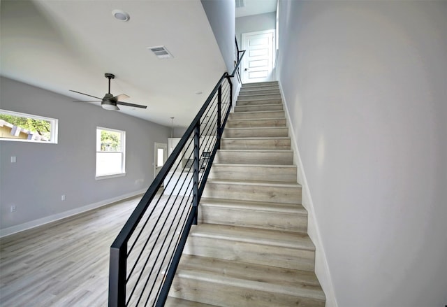 6111 Carnation Ter Unit 1, Austin, TX 78741 - stairs with wood finished floors and a ceiling fan