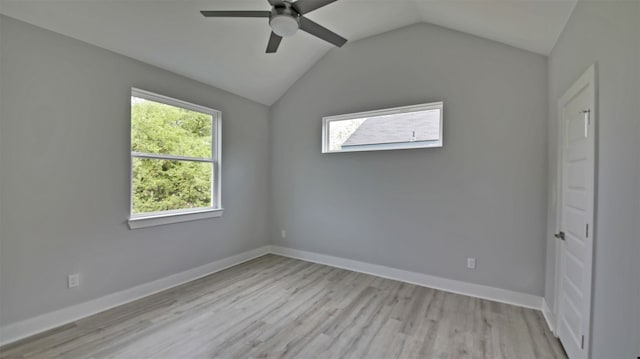 6111 Carnation Ter Unit 1, Austin, TX 78741 - spare room with plenty of natural light, ceiling fan, light wood-style floors, and vaulted ceiling