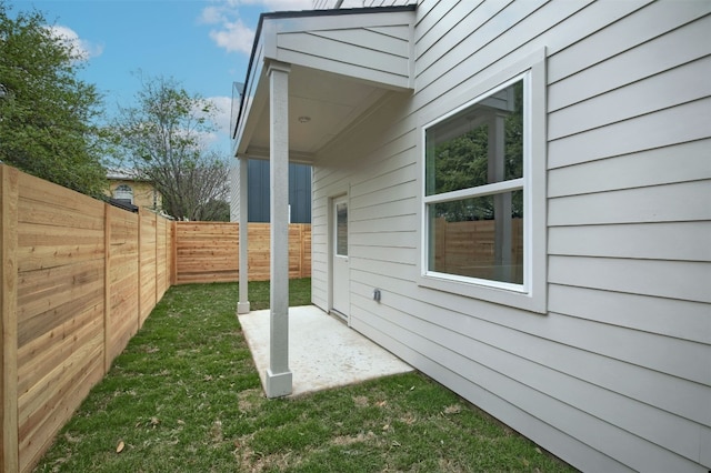 6111 Carnation Ter Unit 1, Austin, TX 78741 - view of property exterior with a patio and a fenced backyard