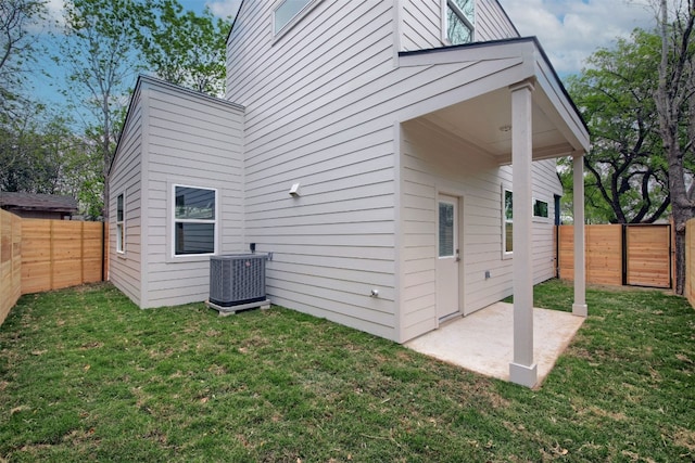 6111 Carnation Ter Unit 1, Austin, TX 78741 - rear view of property with a patio area and a fenced backyard