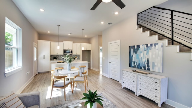 6111 Carnation Ter Unit 1, Austin, TX 78741 - dining area with light wood-style flooring, ceiling fan, and recessed lighting