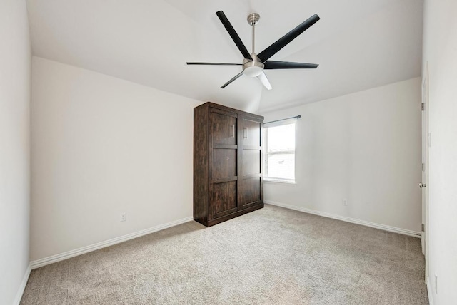2953 Diego Dr, Round Rock, TX 78665 - unfurnished bedroom featuring light colored carpet, lofted ceiling, and a ceiling fan