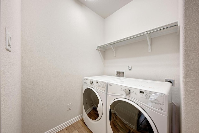 2953 Diego Dr, Round Rock, TX 78665 - laundry area featuring light wood-type flooring and washer and clothes dryer
