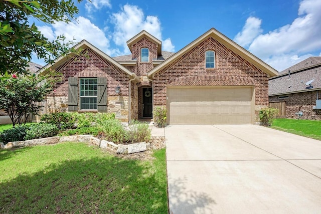 2953 Diego Dr, Round Rock, TX 78665 - traditional-style house with brick siding, driveway, and a garage