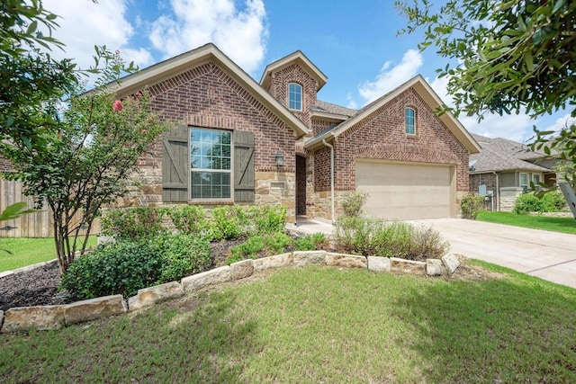 2953 Diego Dr, Round Rock, TX 78665 - view of front facade featuring brick siding, concrete driveway, an attached garage, and stone siding