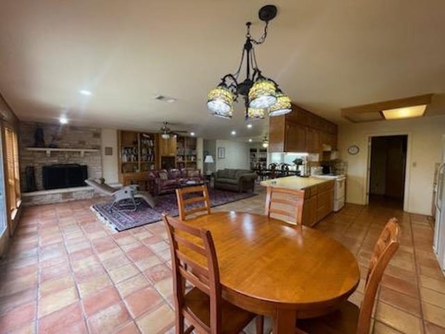 817 Mountain Creek Rd, Marble Falls, TX 78654 - dining space with a fireplace